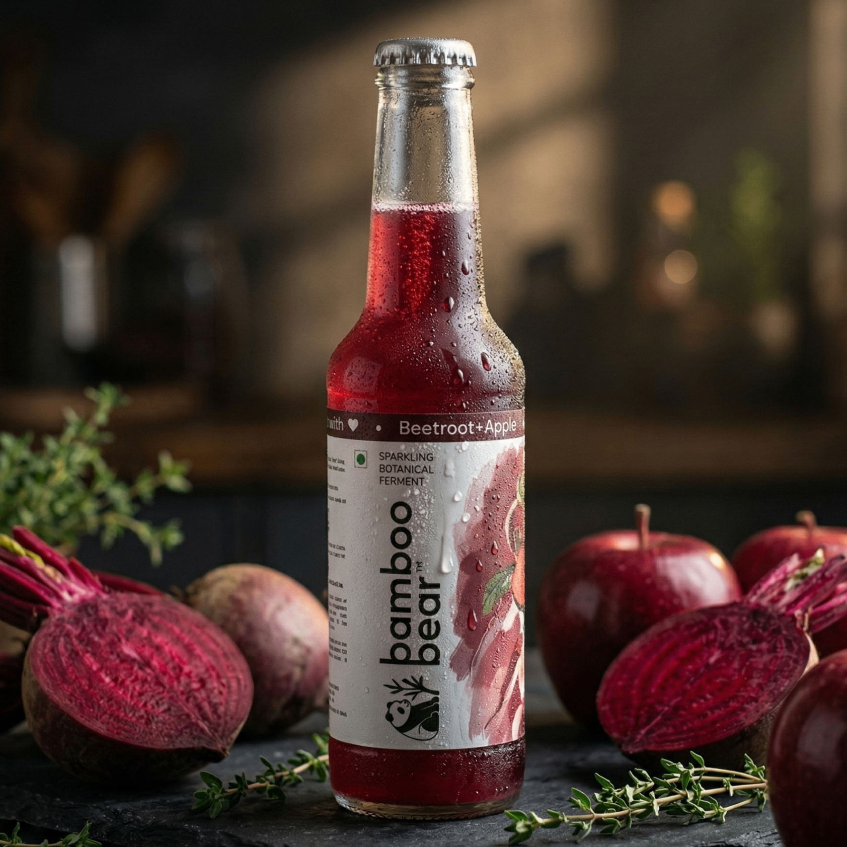 Bamboo Bear Beetroot and Apple bottle surrounded by beetroot halves and red apples.